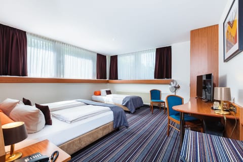 Standard Double or Twin Room | Minibar, desk, iron/ironing board, free cribs/infant beds