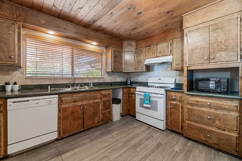 2 Story Cabin | Private kitchen | Microwave, coffee/tea maker