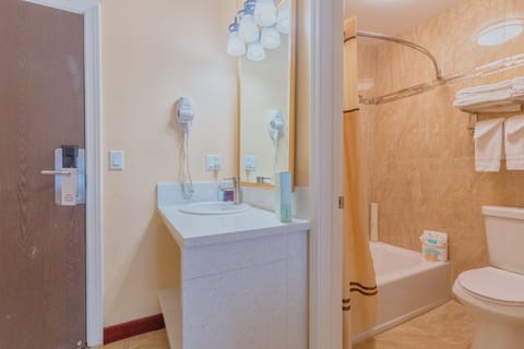 Room, 2 Queen Beds | Bathroom | Combined shower/tub, free toiletries, hair dryer, towels