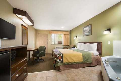 Suite, 1 King Bed, Hot Tub | Desk, iron/ironing board, free cribs/infant beds, rollaway beds
