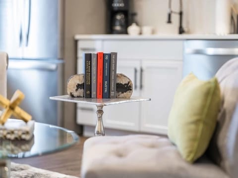 A cozy nook with books and decor invites you to unwind with a good read.