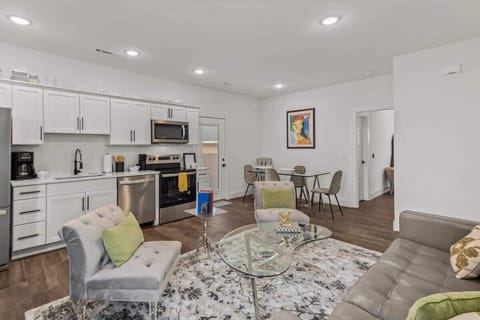 Open-concept living and dining area invites gathering and conversation in a warm, inviting atmosphere.