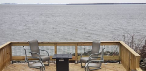 One of four decks overlooking the lake with propane fire pit