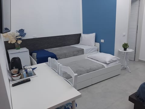 Family Quadruple Room, Non Smoking | Down comforters, in-room safe, desk, laptop workspace