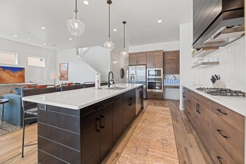 Large kitchen stocked with appliances and utensils for cooking