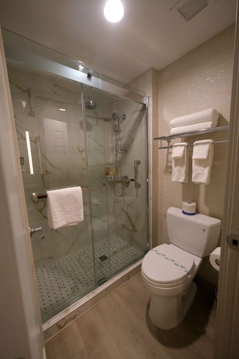 Basic Room, 2 Queen Beds | Bathroom | Combined shower/tub, free toiletries, hair dryer, towels