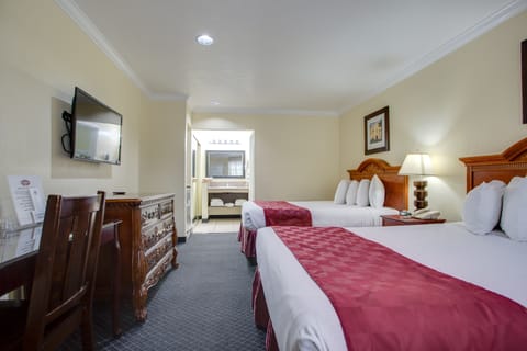 Standard Room, 2 Queen Beds | In-room safe, laptop workspace, blackout drapes, iron/ironing board