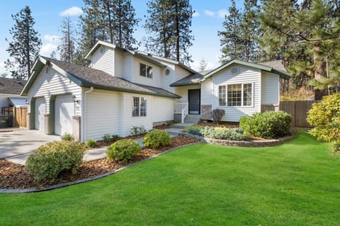 Whispering Pines Post Falls.  Driveway has room for 4 cars, plus RV parking on left.  Hope to welcome you soon!