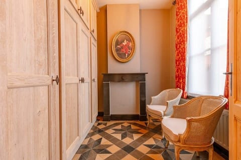 Dressing corner with vintage chair and wardrobe charm