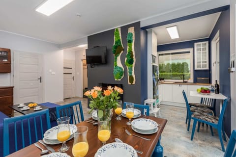Large table with chairs for eating communal meals.