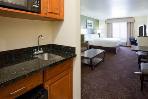 Suite, 1 King Bed (Additional Living Area) | Desk, laptop workspace, blackout drapes, iron/ironing board