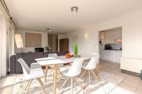 Bright and spacious living room with family dining area