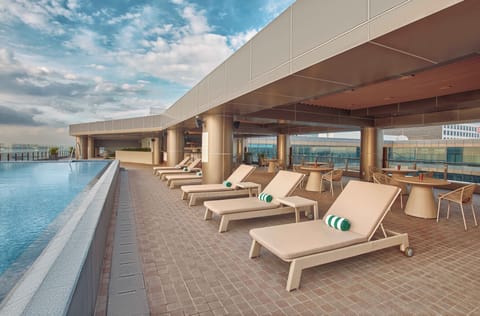 Outdoor pool, open 6:00 AM to 9:00 PM, sun loungers