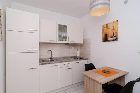 Apartment (One Bedroom Apartment with Shared Ter) | Private kitchen | Fridge