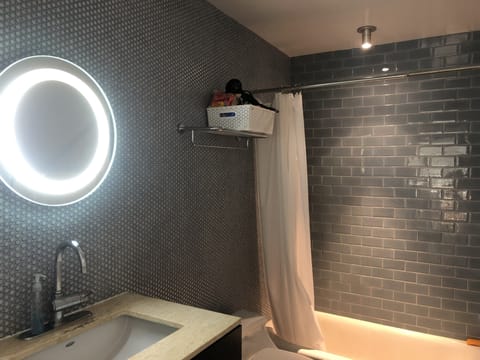 Aqua blue style Bathroom with Tub and Strong Water Pressure