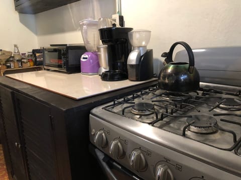 Full-size fridge, coffee/tea maker, blender, coffee grinder