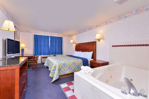 Suite, 1 King Bed (Jacuzzi) | Desk, iron/ironing board, free WiFi, bed sheets