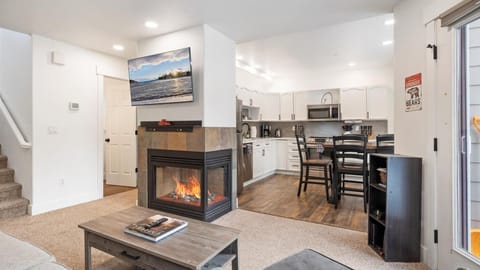 Open concept living room, kitchen, and dining area.