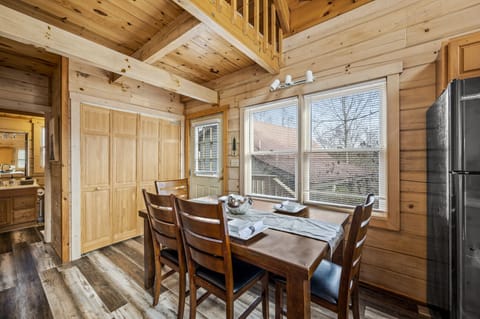Dining table with four chairs, and a hidden bench.
