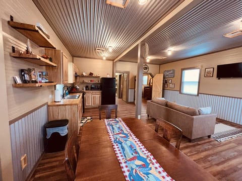 Both the living and dining areas face a big Roku-equipped smart TV. The cottage also comes with Wifi Internet service!