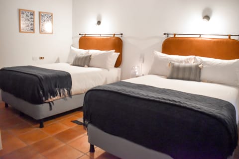 Deluxe Room | Individually decorated, blackout drapes, iron/ironing board, free WiFi