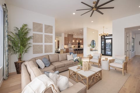 Living Room and Entry Way - This light and open living room provides lots of seating and is conveniently located adjacent to the Kitchen and Dining Table.