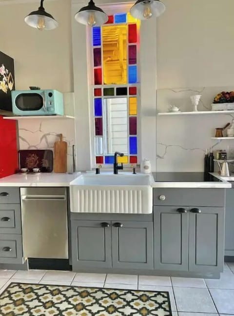 The kitchen is compact, but it comes with everything you need. Dishwasher also.