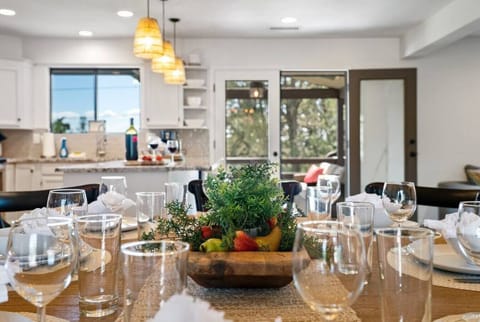 The dining table seats up to nine and the kitchen island seats an additional three