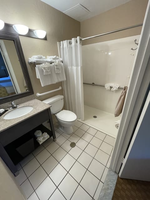 Deluxe Room, 2 Queen Beds, Accessible (Roll-in shower) | Bathroom | Free toiletries, hair dryer, towels, soap