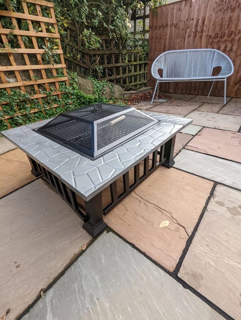 South facing patio area with fire pit.