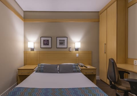 Standard Double Room | Minibar, in-room safe, desk, blackout drapes