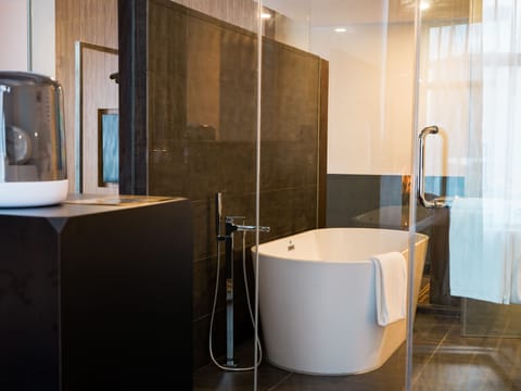 Bronze Suite | Bathroom | Hair dryer, slippers, towels, soap