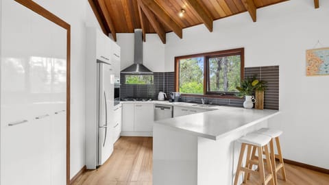 The kitchen is equipped with modern amenities and equipment.