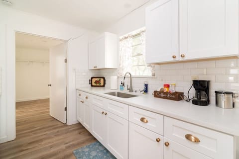 Bright, fully equipped kitchen with modern finishes and plenty of counter space