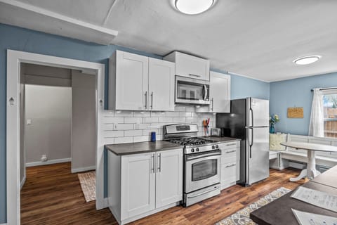 Kitchen & dining area, bluetooth speaker, ample cooking supplies & dishes.