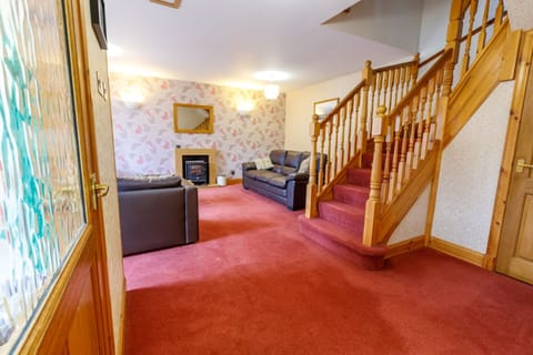 Open plan living room with digital TV and carpetting and electric heating