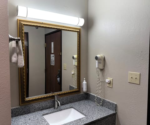 Desk, laptop workspace, blackout drapes, iron/ironing board