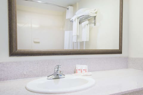 Combined shower/tub, hair dryer, towels, soap