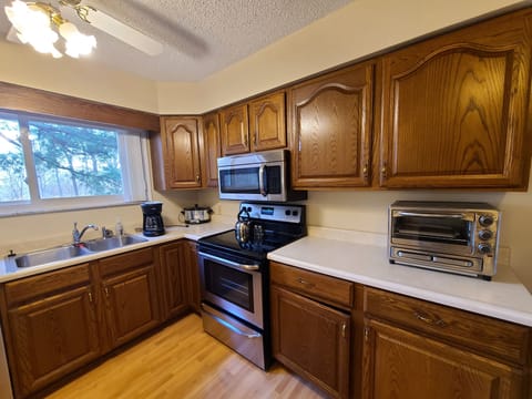 Kitchen, electric range, microwave, dishwasher & refrigerator