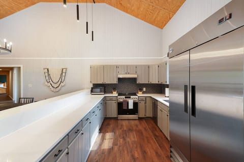 Whip up your favorite meals with ease in our fully-equipped kitchen, complete with a large commercial refrigerator and ample storage space in our drawers and cabinets.