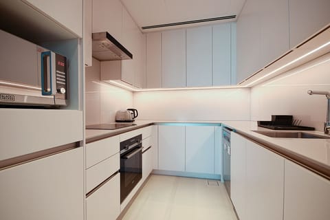 Deluxe Apartment, 1 Bedroom | Private kitchen | Full-size fridge, dishwasher, cookware/dishes/utensils