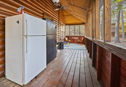 Keep your refreshments cool with the outdoor fridge on this spacious screened-in porch.