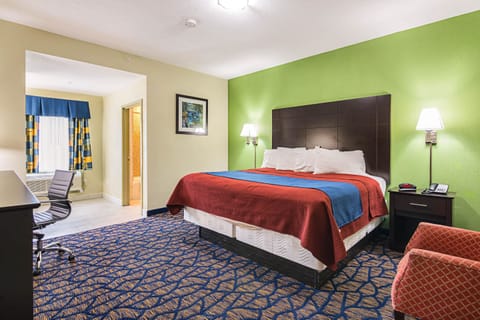 Deluxe Room, 1 King Bed, Non Smoking | In-room safe, desk, iron/ironing board, free cribs/infant beds