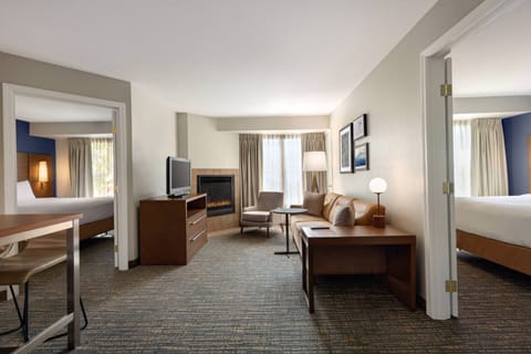 Suite, 2 Bedrooms, Fireplace | Desk, laptop workspace, blackout drapes, iron/ironing board