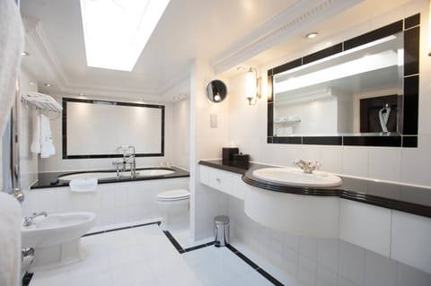 Standard Suite, 1 King Bed | Bathroom | Designer toiletries, hair dryer, bathrobes, slippers