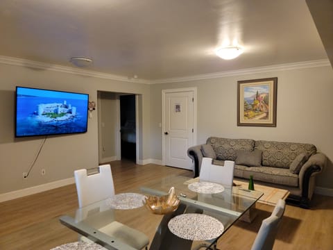Family Suite, 2 Bedrooms, Kitchen | Living area | 65-inch TV with digital channels, heated floors