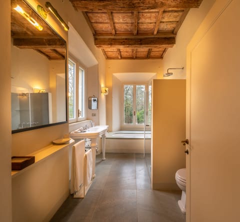 Presidential Suite, Pool View | Bathroom | Separate tub and shower, deep soaking tub, rainfall showerhead