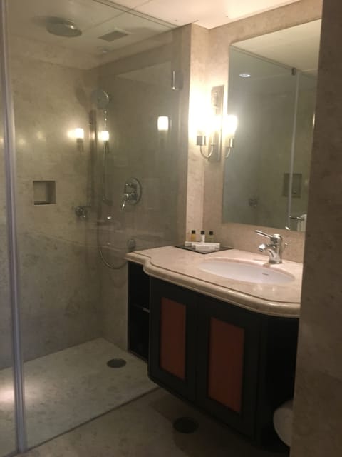 Suite, 1 King Bed | Bathroom | Shower, rainfall showerhead, designer toiletries, hair dryer