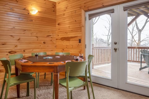 Card table near the deck entrance in the recreation room.
