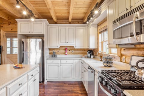Kitchen features a gas stove.